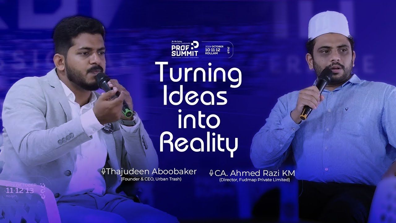 Two speakers on a stage, each holding a microphone, with the title "Turning Ideas into Reality" between them.